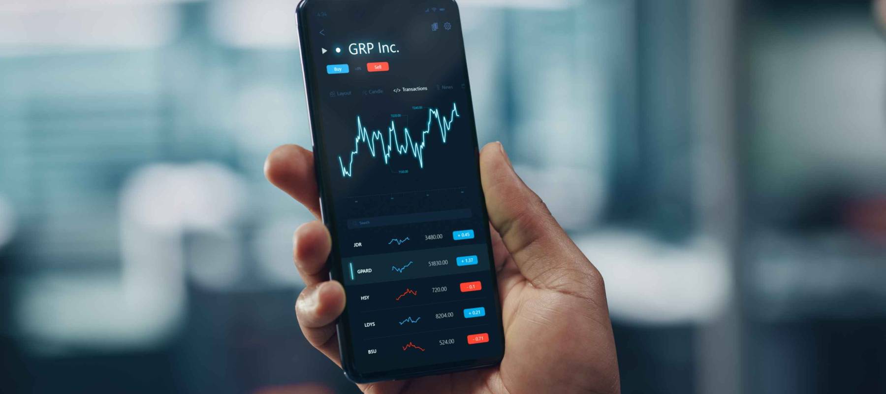 Black Businessman Holding Smartphone and Checking Stock and Cryptocurrency Market in Office. African-American Businessperson using Internet with Mobile Phone Device. Over Shoulder Shot