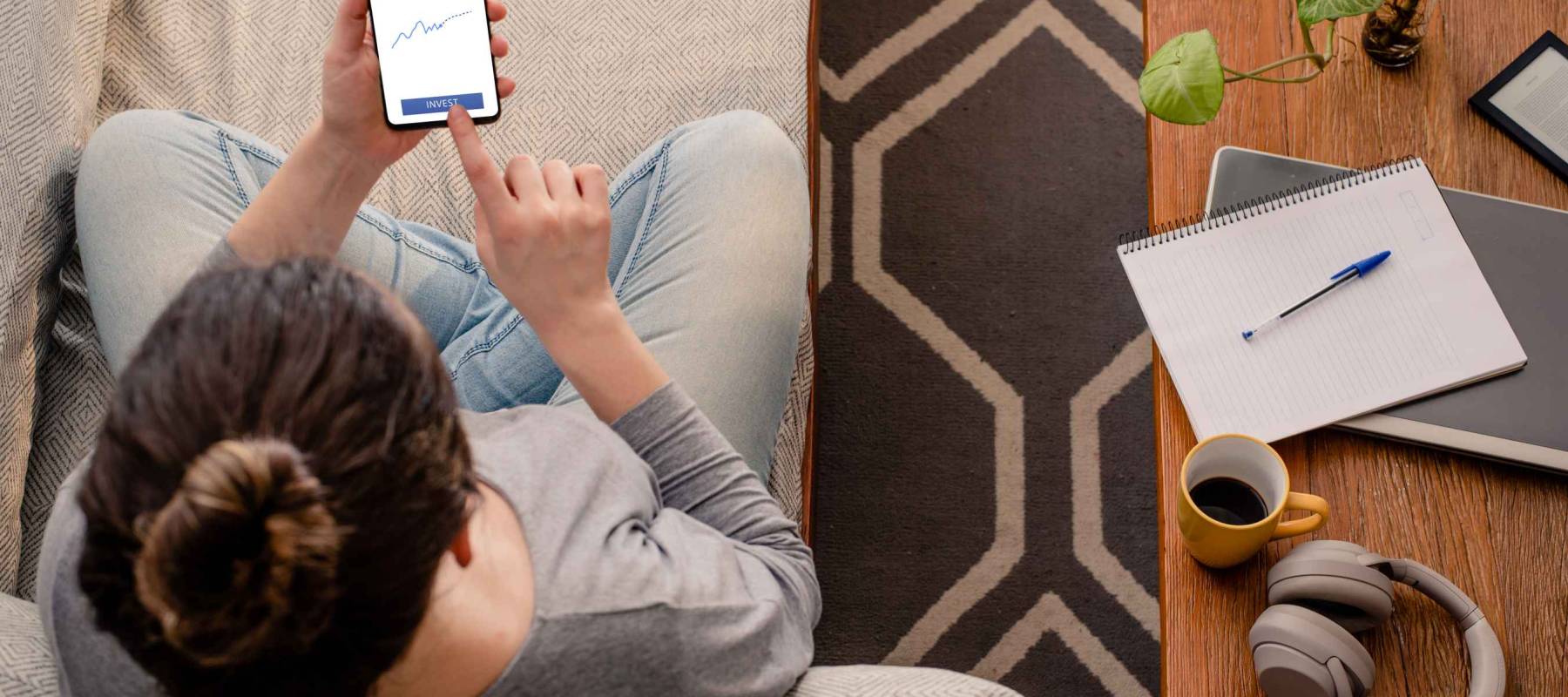 Woman using investment mobile app