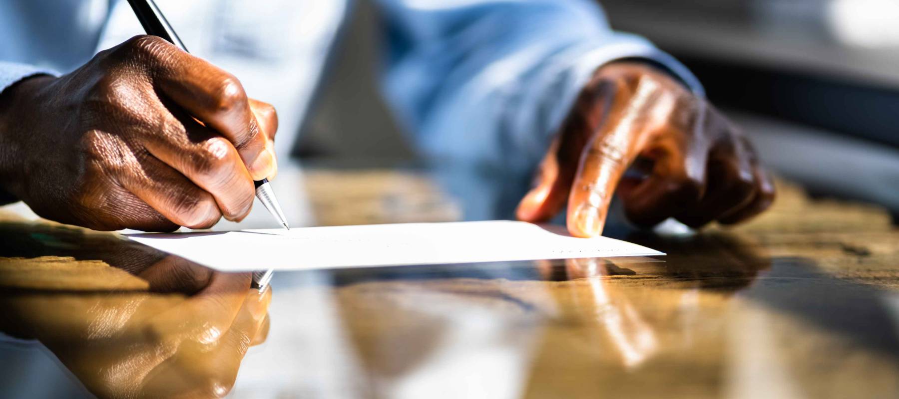 African American Writing Check. Company Payroll Cheque