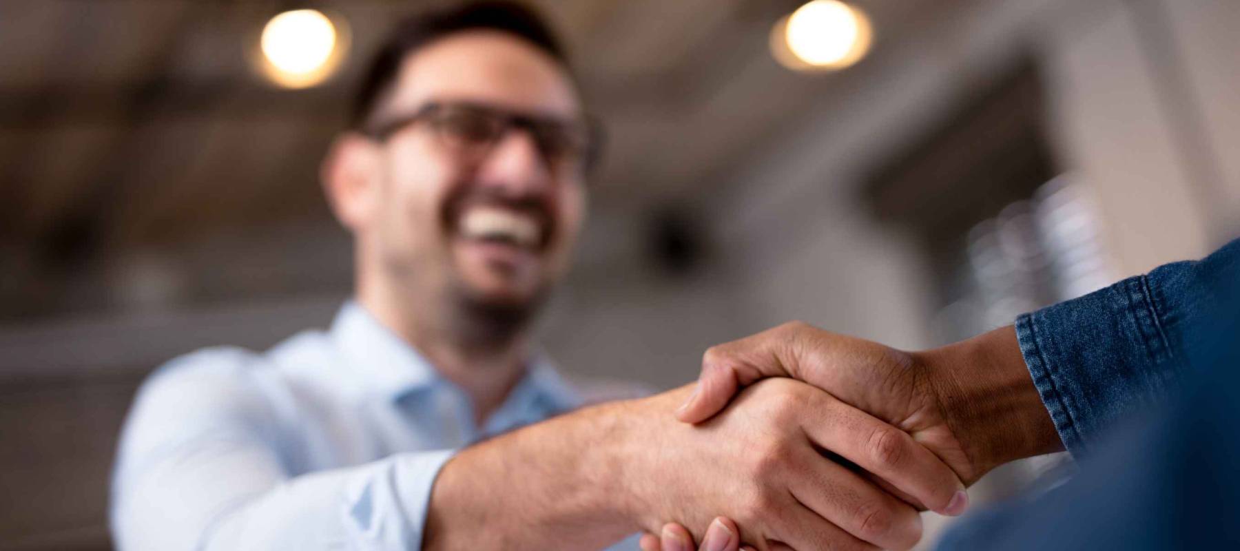 Business people shaking hands.