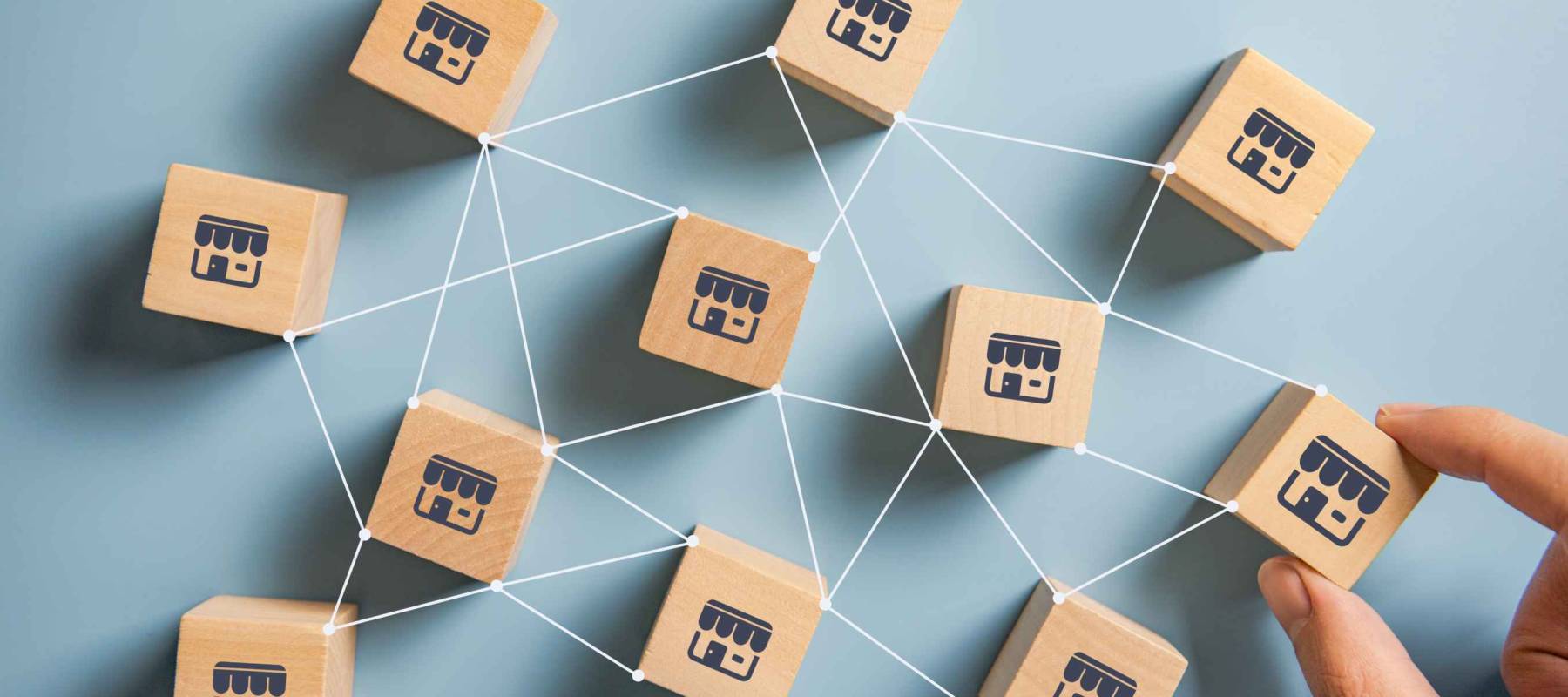 Woman hand choose wood blog with franchise marketing system in global network connection. Franchise business concept.