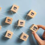 Woman hand choose wood blog with franchise marketing system in global network connection. Franchise business concept.