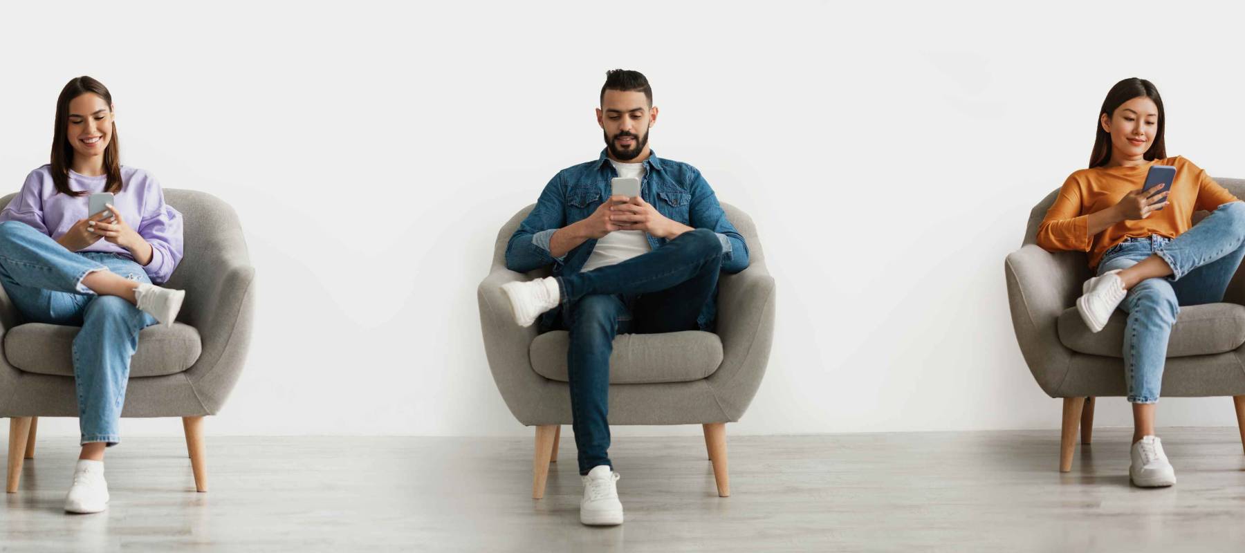 Online Communication. Smiling Multiethnic People Using Smartphones