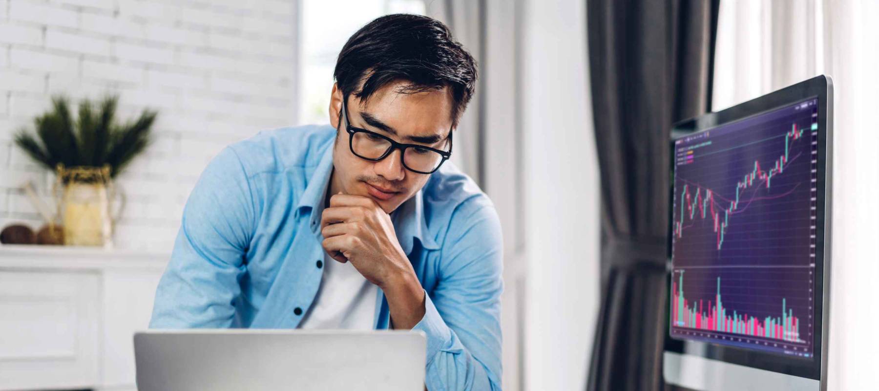 Successful of business trader investor asian man use technology computer