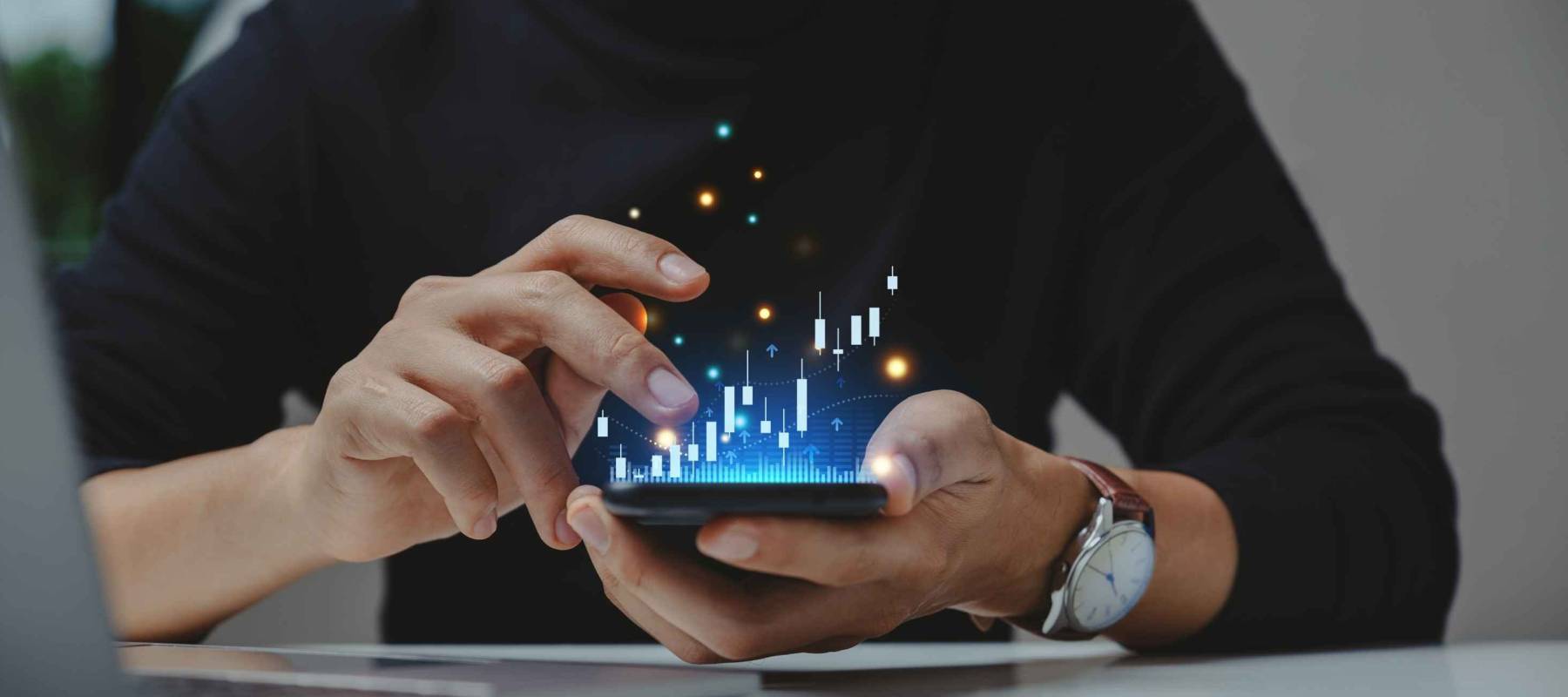 Financial and business investment concept. Businessman using smartphone analyze investment in stock market. growth graph chart on screen.