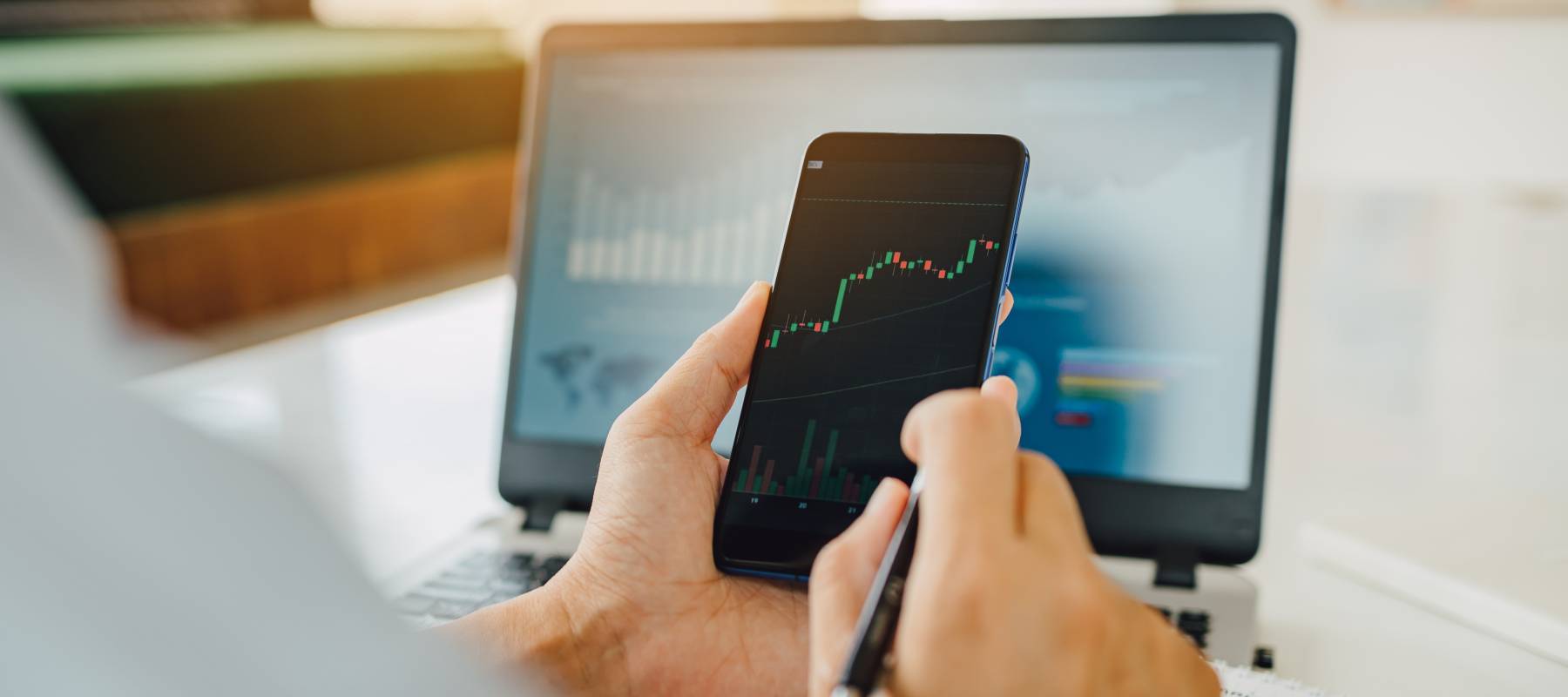 Businessman invest bitcoin price digital chart exchange on smartphone