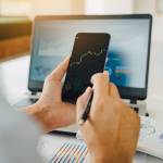Businessman invest bitcoin price digital chart exchange on smartphone