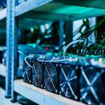 Bitcoin and crypto mining computer machines in a big data center. High tech servers at work