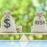 Risk assessment / risk analysis and management concept on a scale.