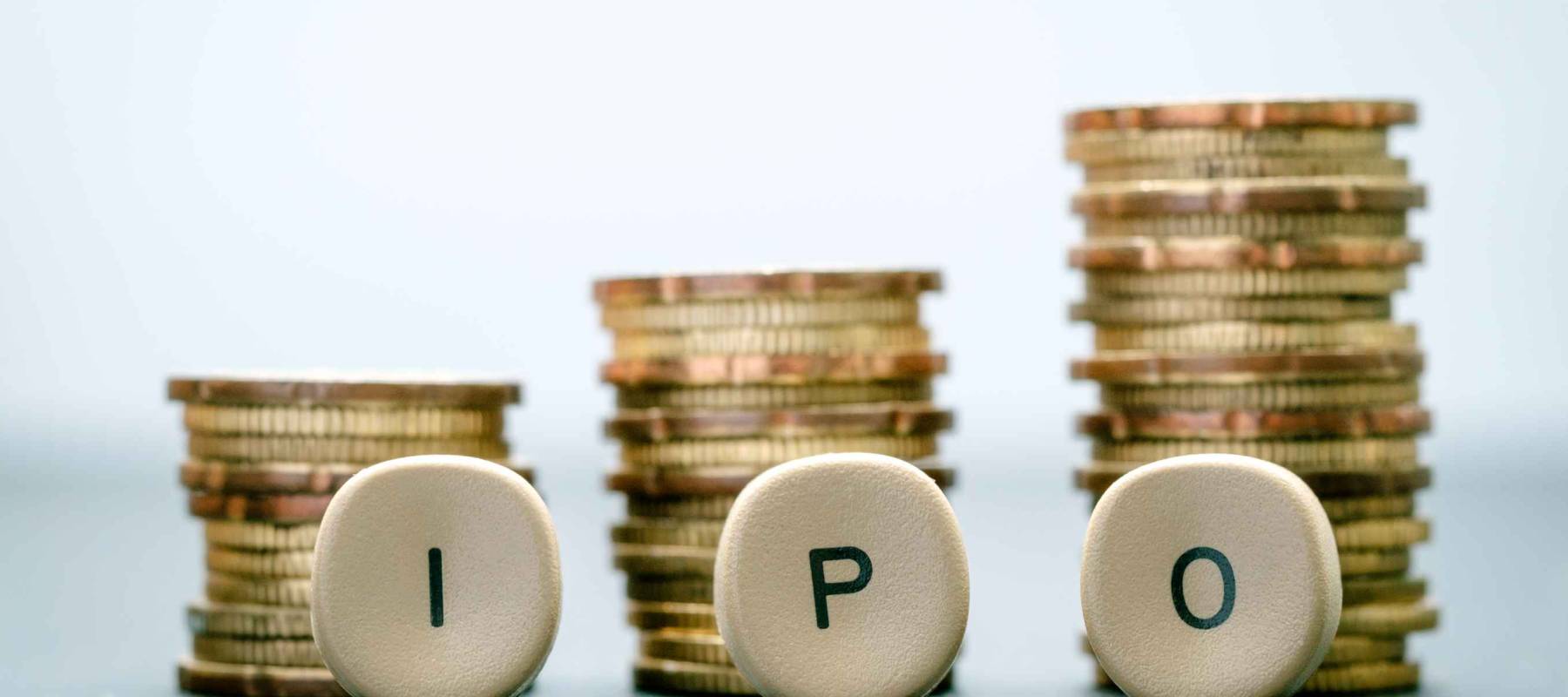 IPO letter blocks  and stacked coins. IPO stands for Initial Public Offering.