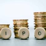 IPO letter blocks  and stacked coins. IPO stands for Initial Public Offering.
