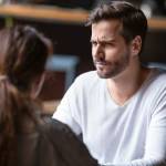 Doubting dissatisfied man looking at woman, bad first date concept,