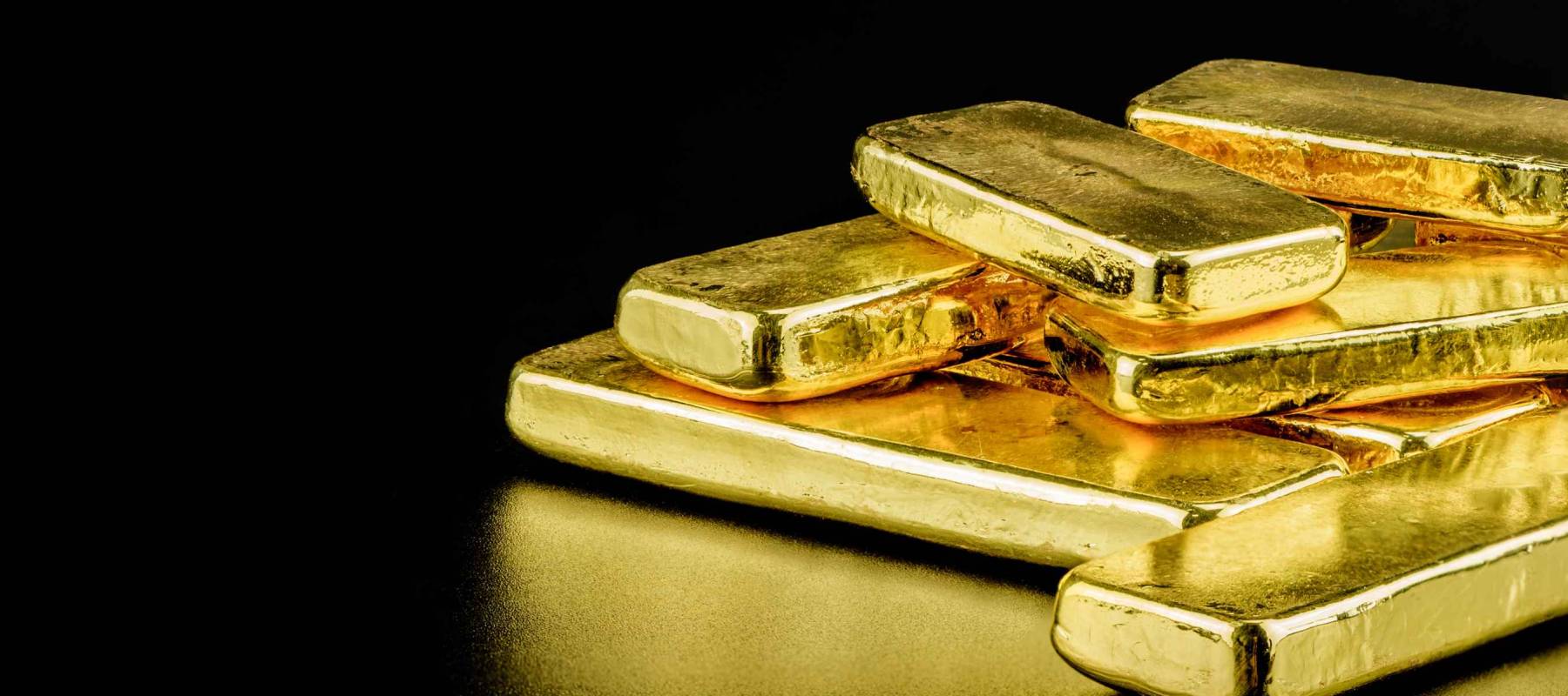 close up pure gold bar ingot put on the black color leather surface background represent the business and finance concept idea