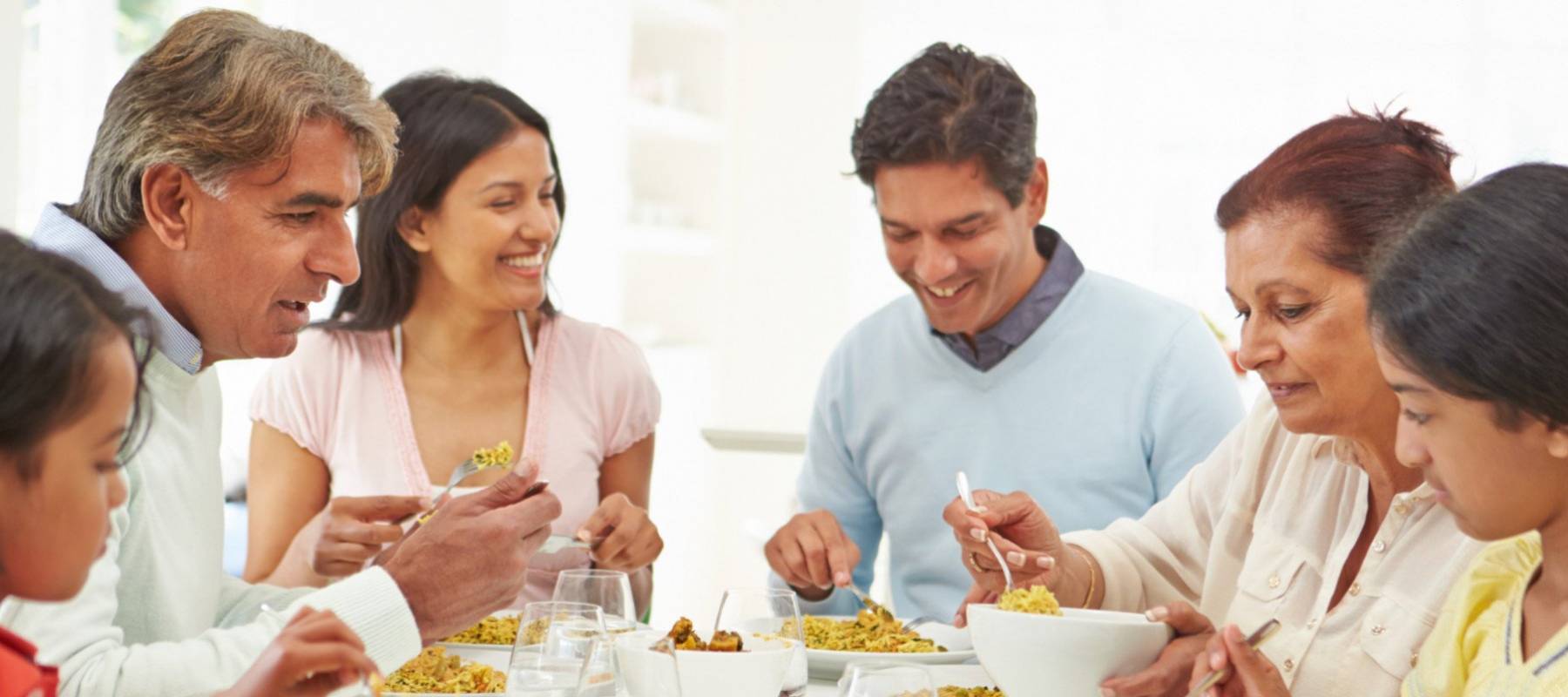 Multi-generational family gathers for dinner