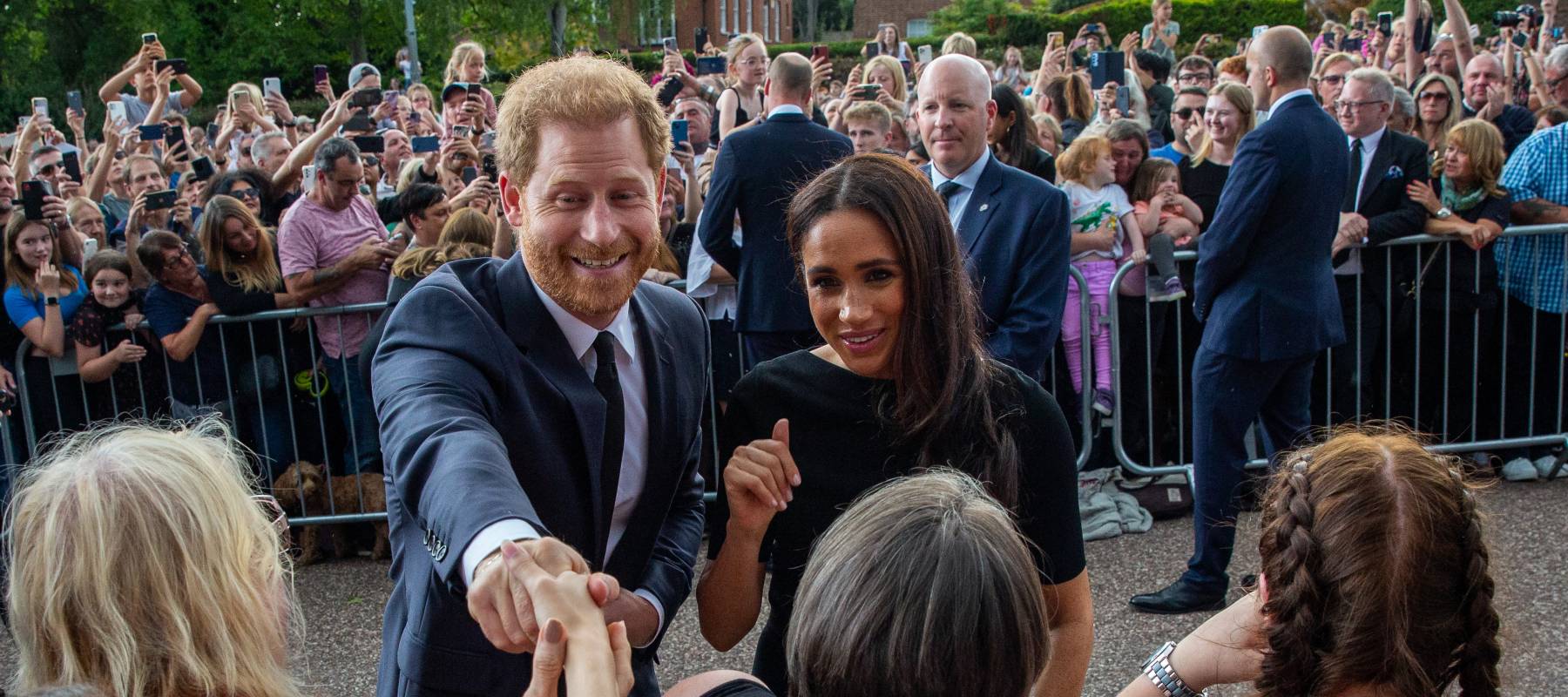 Prince Harry and Meghan, the Duke and Duchess of Sussex, greet well-wishers on the Long Walk outside Windsor Castle in Windsor, U.K., Sept. 10, 2022.
