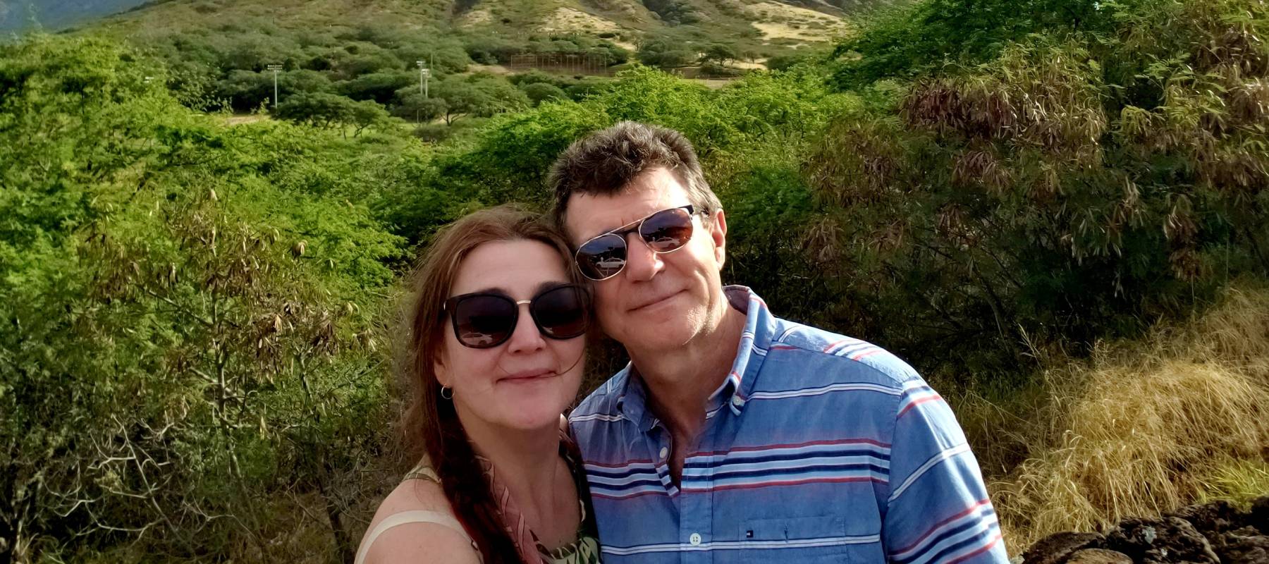 Happy, smiling middle age couple pose for a selfie together.