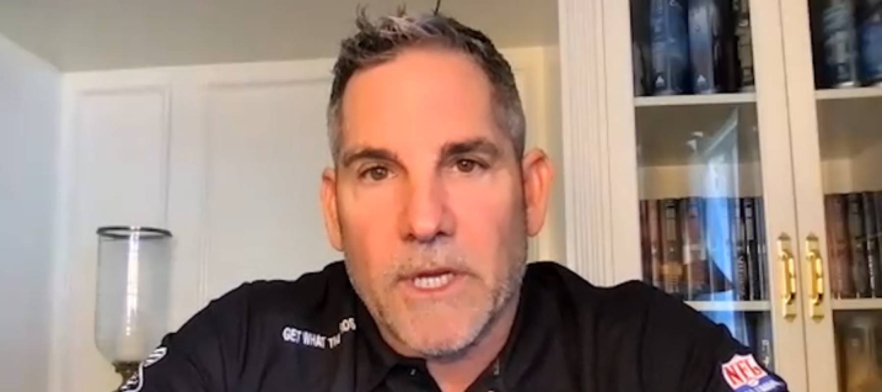 Grant Cardone seen in home office speaking directly to camera.