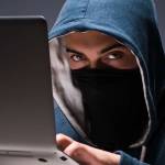 Hacker using laptop