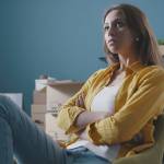 Angry couple fighting while doing a home relocation, feelings and lifestyle concept.