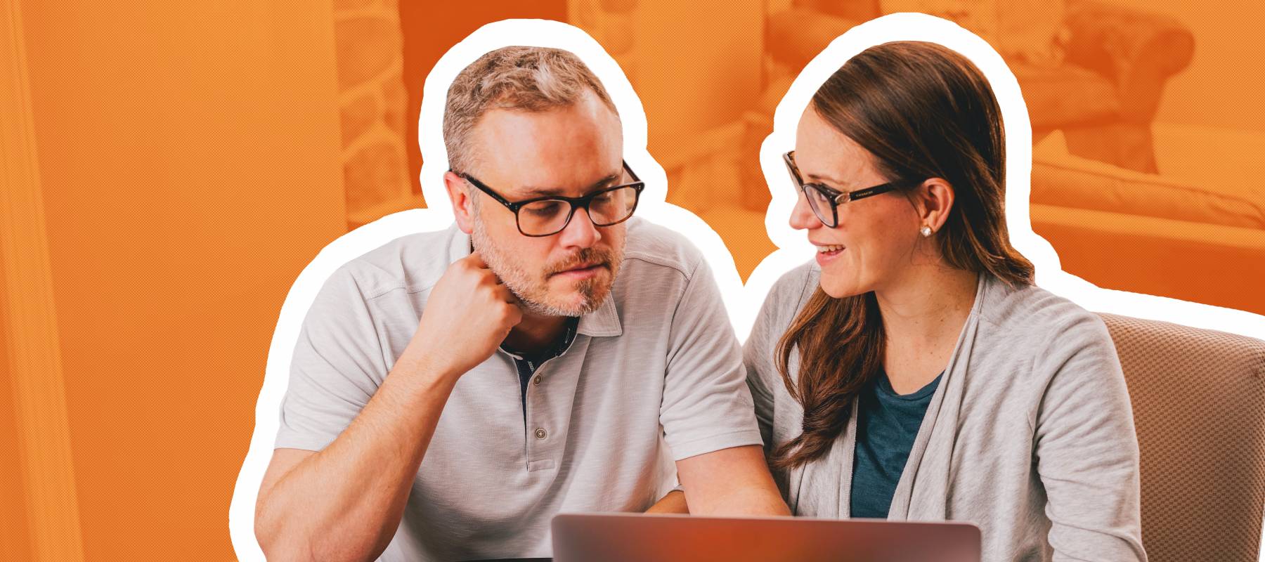 Couple discussing finances at computer