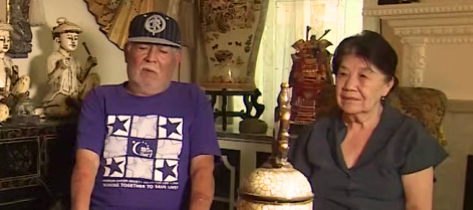 Ismael and Angelita Ramirez sit in their home, speaking with media.