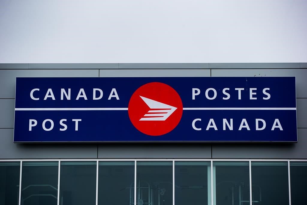 The Canada Post logo is seen on the outside the company&#039;s Pacific Processing Centre, in Richmond, B.C., on June 1, 2017. 