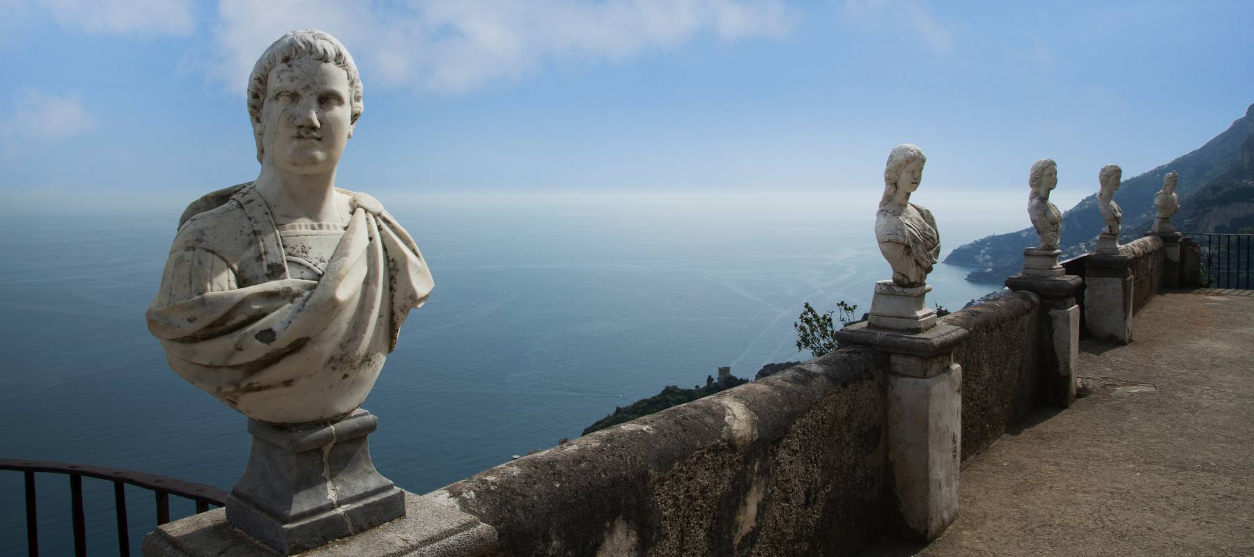 Roman statues on the &#039;Terrace of Infinity&#039; looking over Atrani and the Amalfi Coast at the Villa Cimbrone Gardens, Ravello, Campania, Italy.