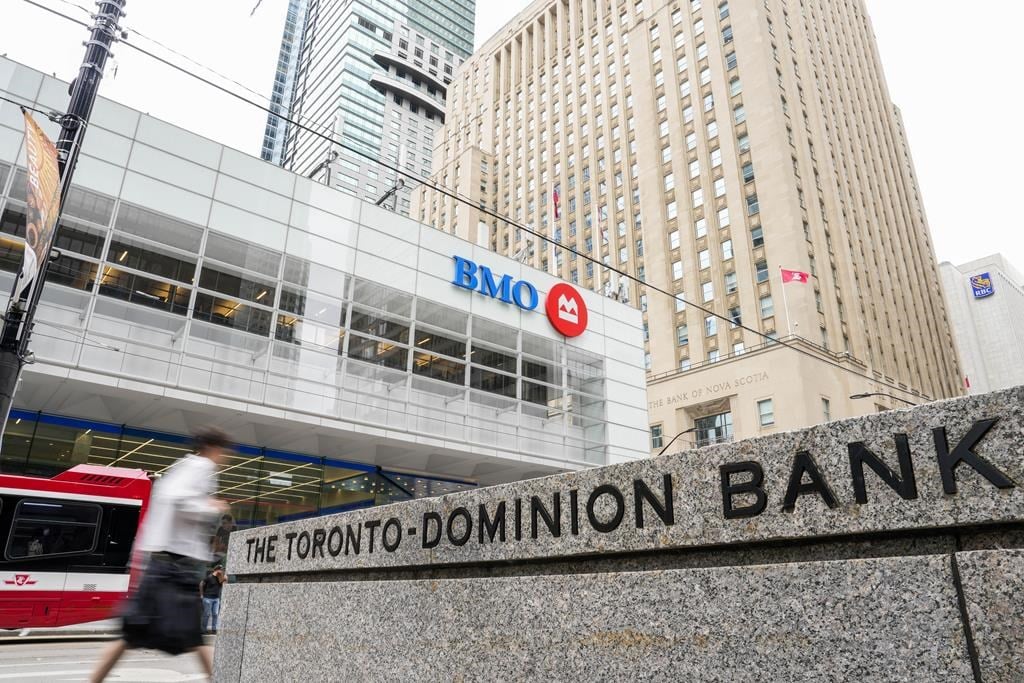 TD Bank and Bank of Montreal signage is pictured in the financial district in Toronto, Friday, Sept. 8, 2023. 