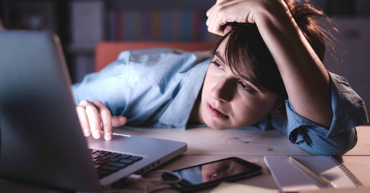 Illustration of a person lying awake at night worried about financial uncertainty.