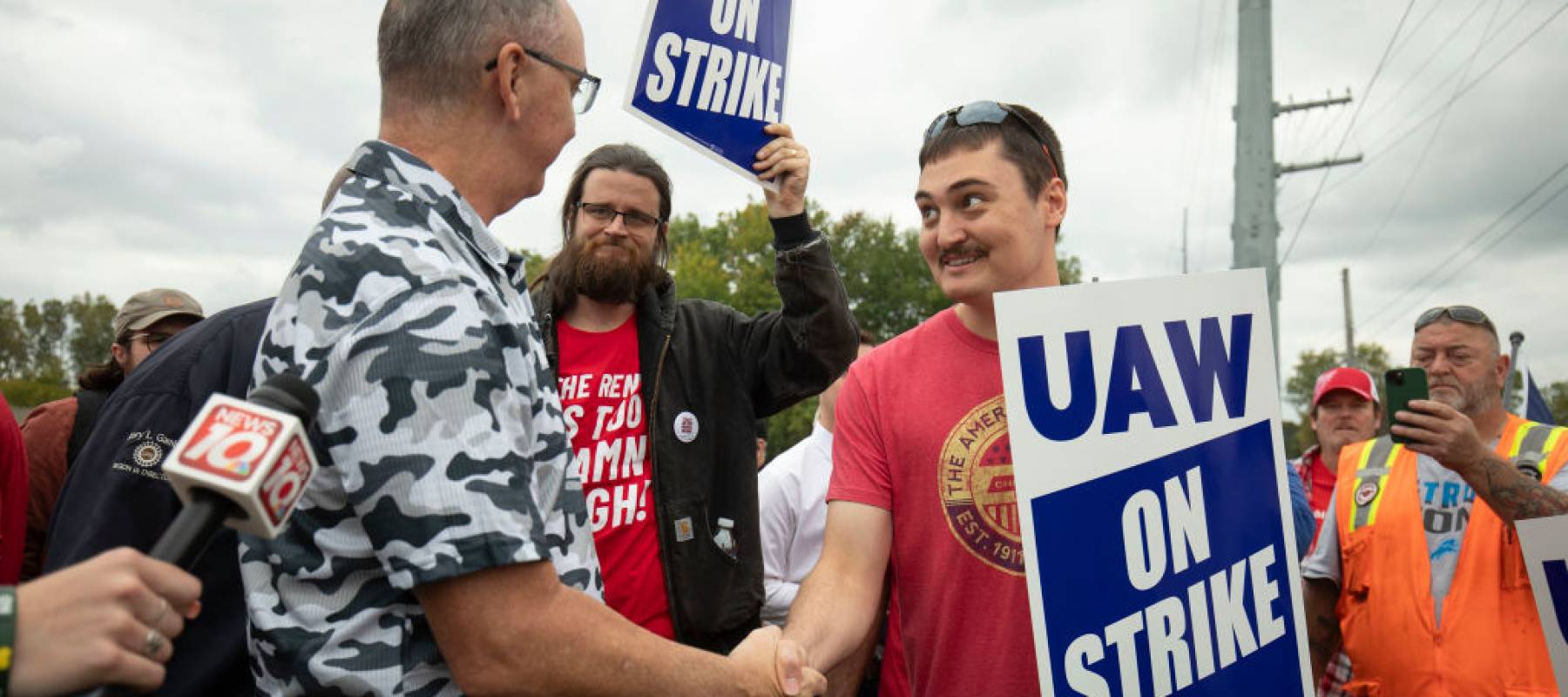 nited Auto Workers President Shawn Fain greets UAW members as they strike the General Motors Lansing Delta Assembly Plant on September 29, 2023 in Lansing, Michigan.