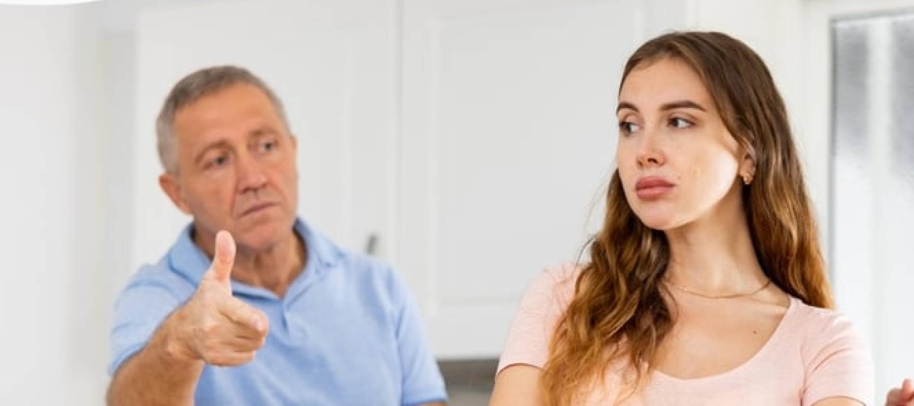 Parents lecturing their adult daughter