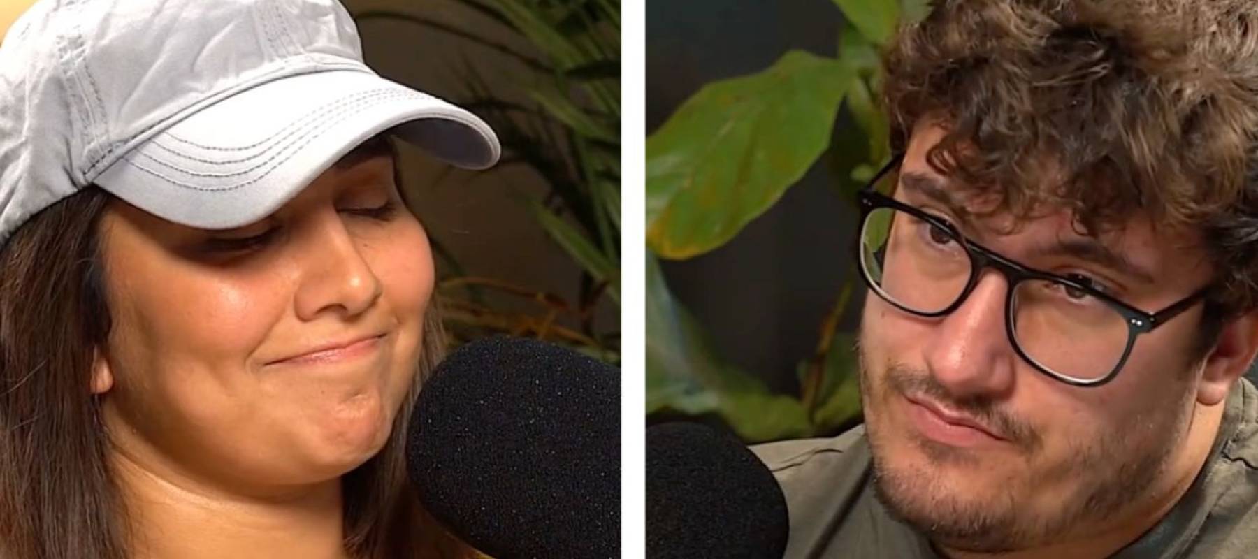 Two people seen speaking into microphones in a studio, man looks disapproving while woman is bashful.
