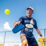 an Regini, 64, of Port Jefferson Station, plays pickleball, a paddle sport on a court at Charles P. Toner Park in Nesconset, New York.