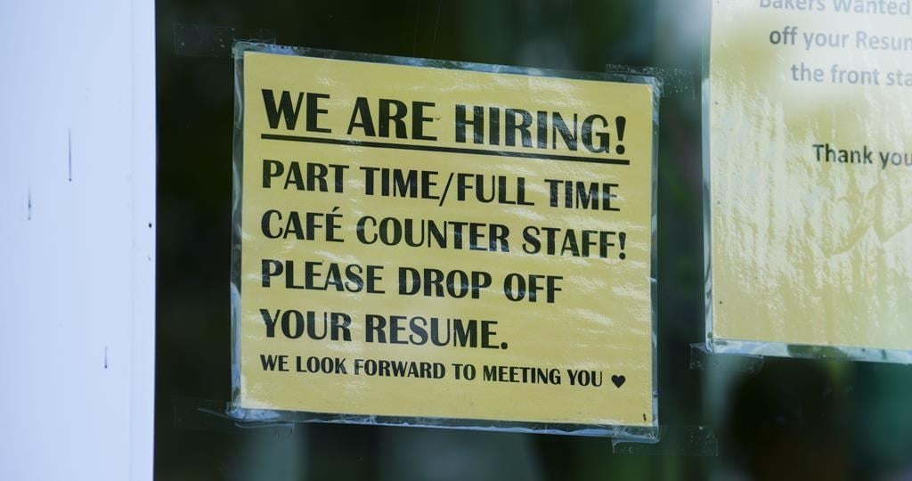 A sign for help wanted is pictured in a business window in Ottawa on Tuesday, July 12, 2022. Statistics Canada is set to release its November labour force survey this morning.