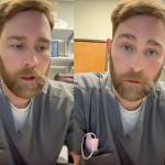 A dentist in grey scrubs addresses the camera.