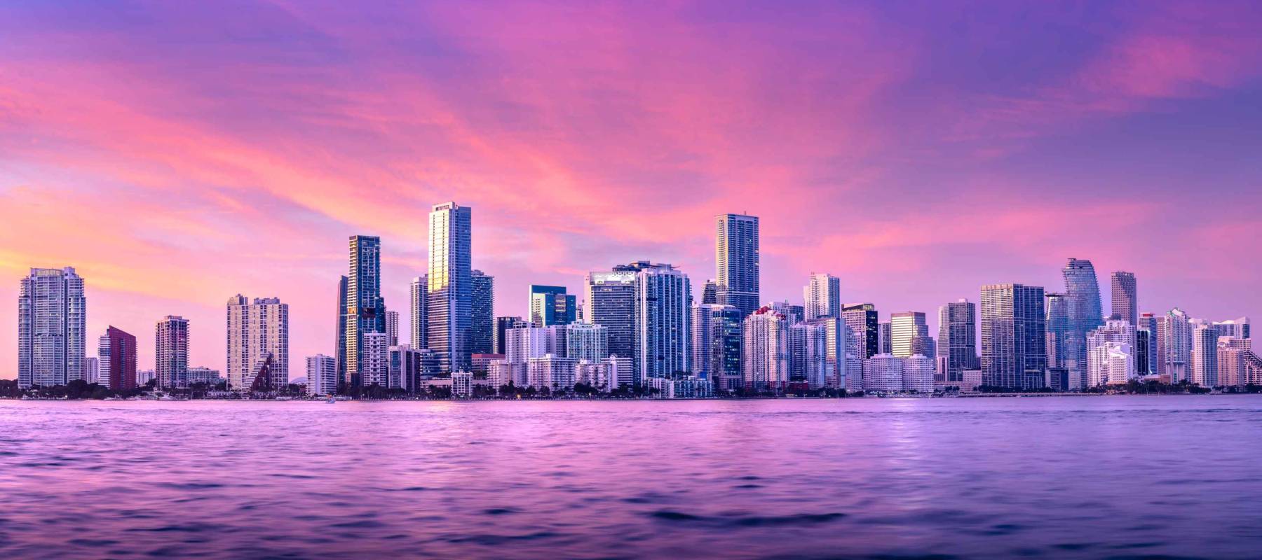 the skyline of miami during sunset