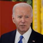 President Joe Biden speaks in the East Room of the White House.