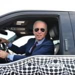 US President Joe Biden drives the new electric Ford F-150 Lightning at the Ford Dearborn Development Center in Dearborn, Michigan on May 18, 2021