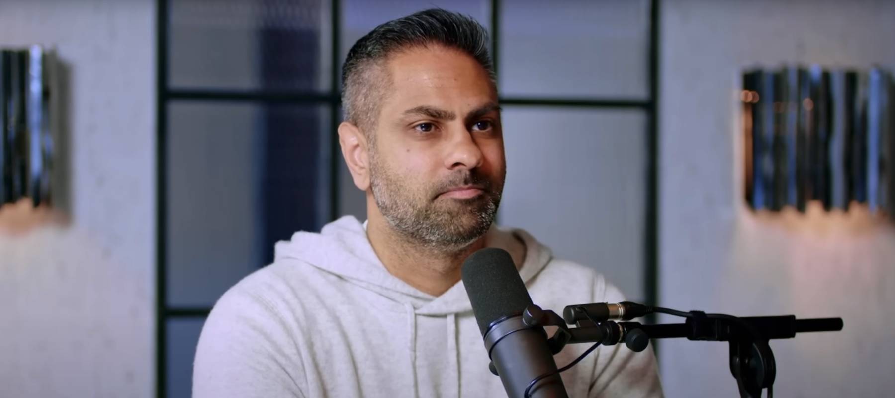 Finance expert Ramit Sethi speaks with entrepreneur Steven Bartlett (not shown) on an episode of The Diary of a CEO podcast.