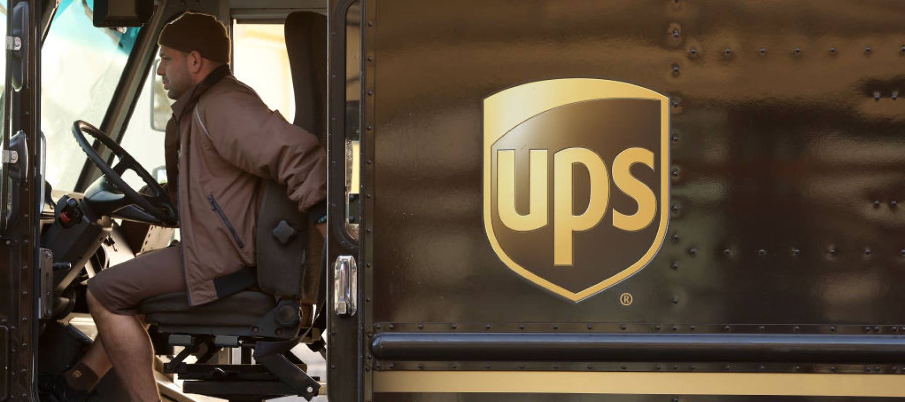 A United Parcel Service (UPS) driver sits in his delivery truck on January 31, 2023 in San Francisco, California.