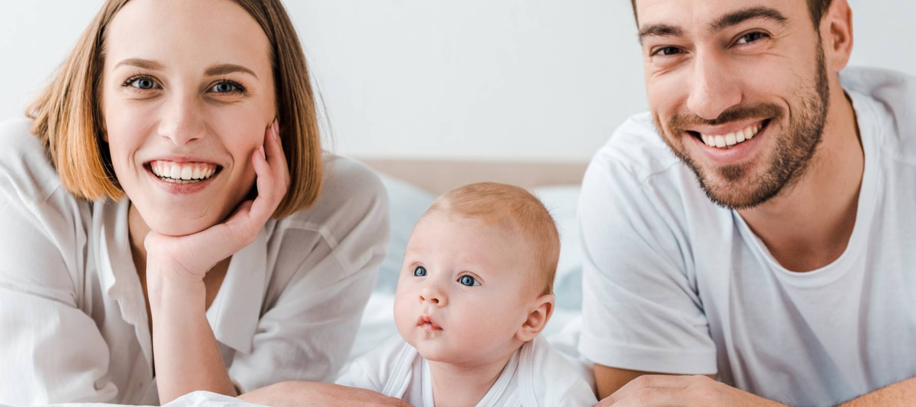 A young couple and their baby.