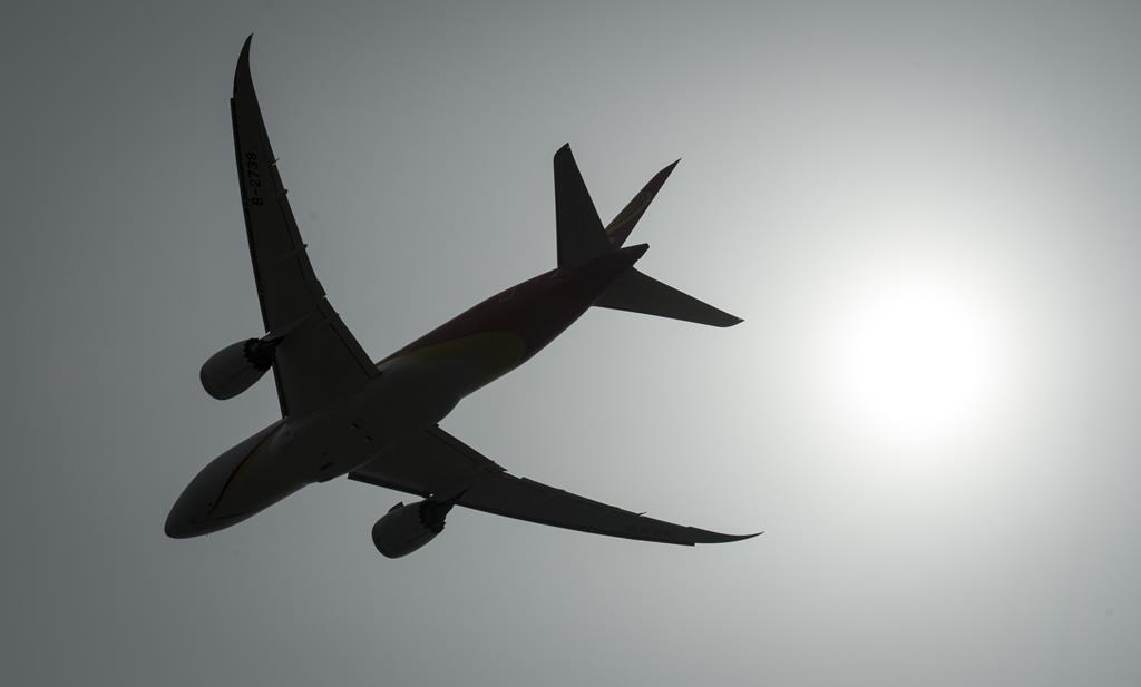 Airlines are calling on the federal government to roll out measures that will spark production of sustainable aviation fuel in Canada. A plane is silhouetted as it takes off from Vancouver In