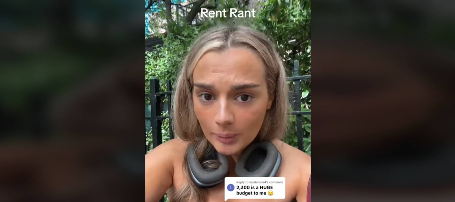 Young woman with headphones around her neck speaking directly to the camera while outside.