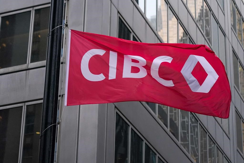 The CIBC logo is displayed on a flag in front of its headquarters in Toronto on Monday, Oct. 25, 2021. 