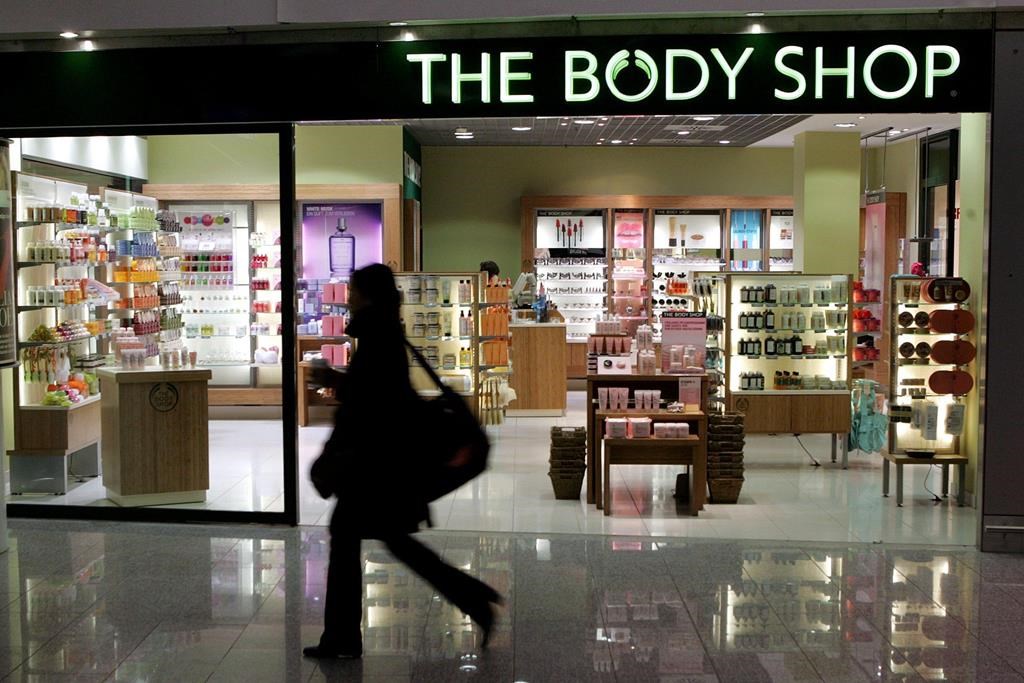 The Body Shop International Limited filed for administration in the U.K. and announced plans to close dozens of stores there last month. A woman passes a Body Shop cosmetics store at the airp