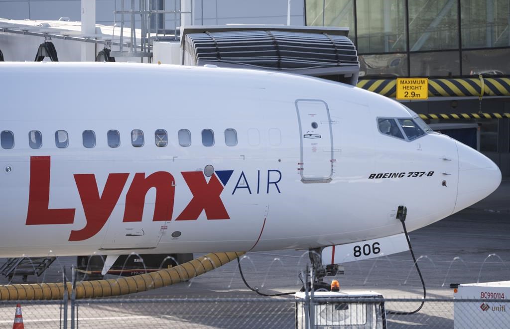 A Lynx Air Boeing 737 jet sits at a gate at the international airport in Calgary on Friday, February 23, 2024. Flair Airlines CEO Stephen Jones says he still hopes to add several Lynx Air pla