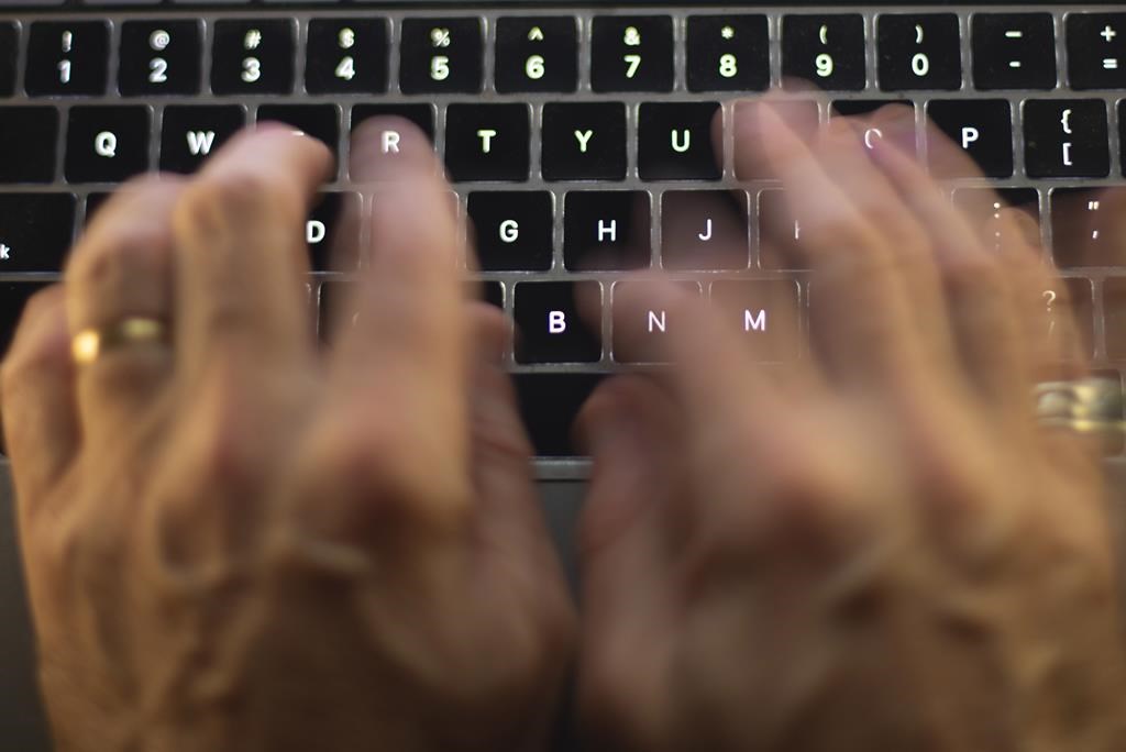 Canada&#039;s financial intelligence agency says it has been hit by a cyber attack. A man uses a computer keyboard in Toronto in this Sunday, Oct. 9 photo illustration.