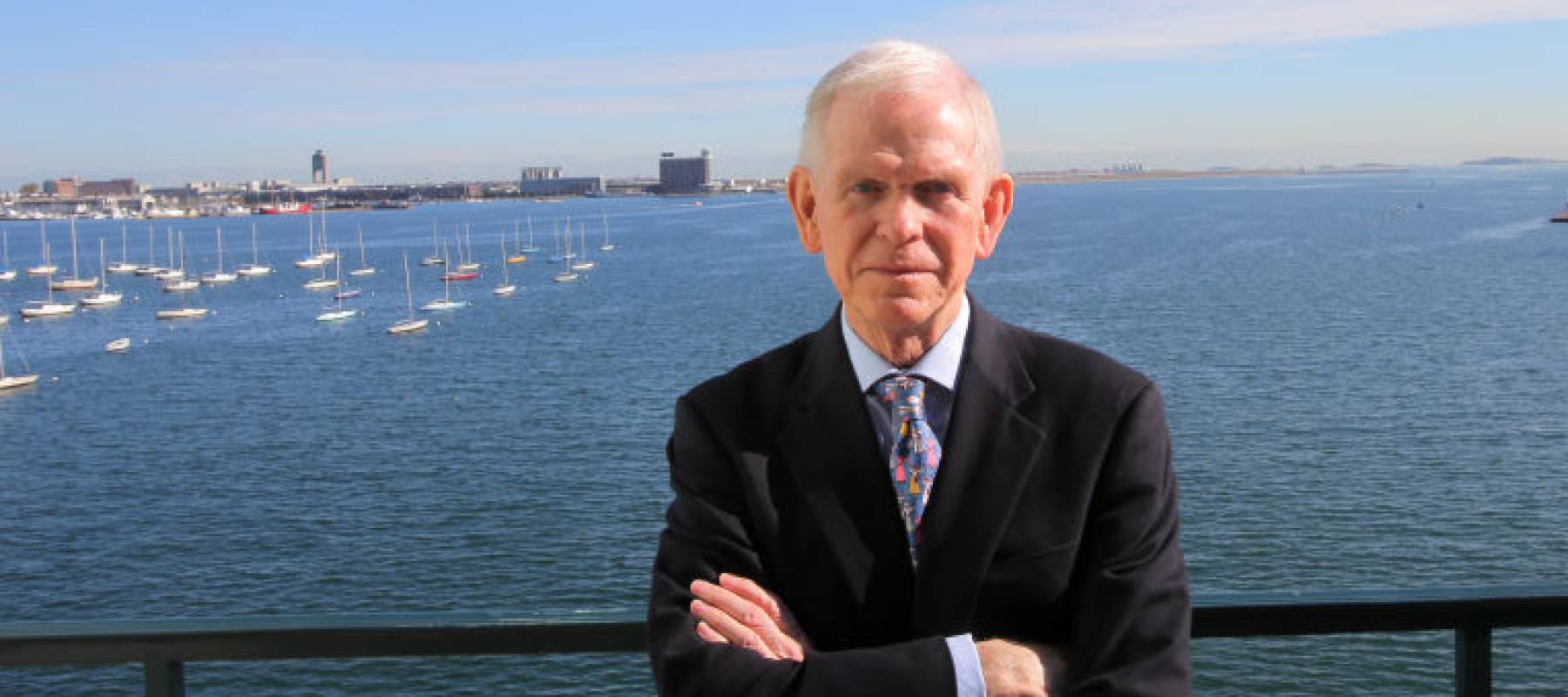 Renowned investment manager Jeremy Grantham poses on a balcony.