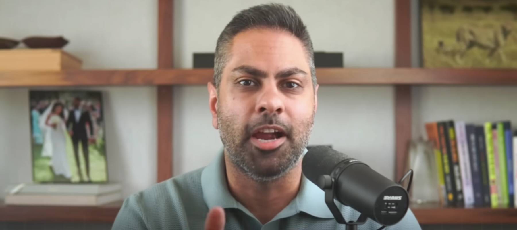 Ramit Sethi seen in his home office, speaking directly to camera.