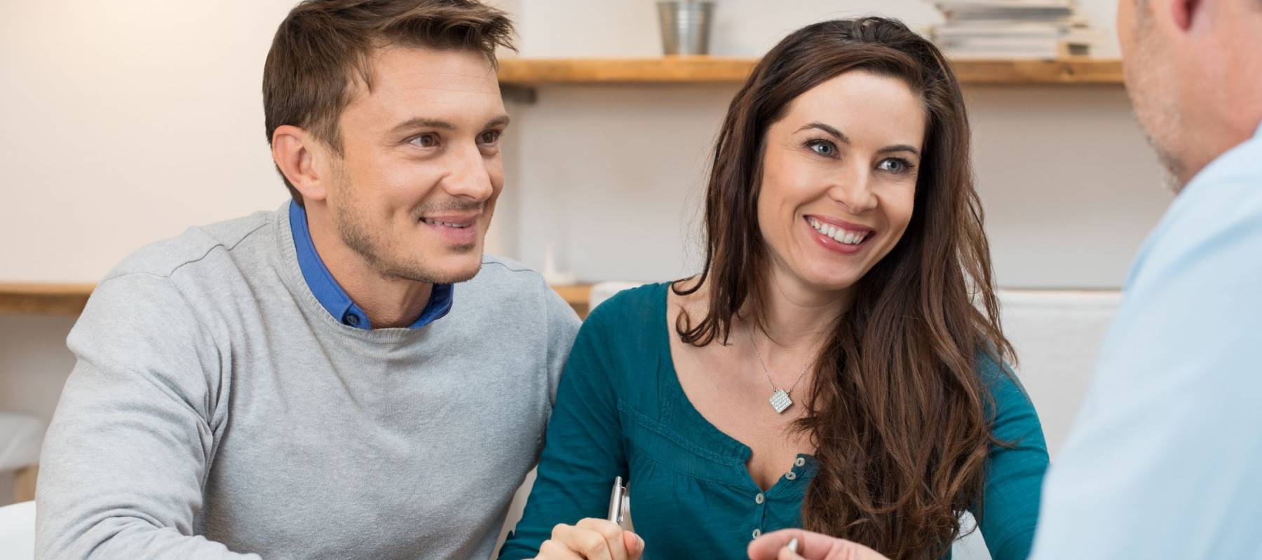 Young couple meeting financial advisor for investment